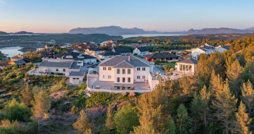 an aerial view of a large house on a hill at Villa Freya with stunning sea view in Kristiansund