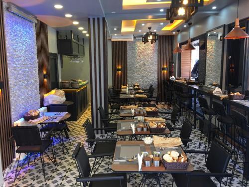 a restaurant with tables and chairs and a bar at Bonita Boutique in Istanbul