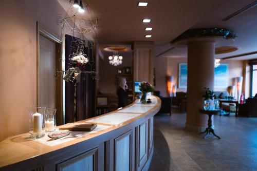 a bar in a room with a counter with candles at Mainalon Resort in Tripoli