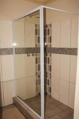 Un baño de Ingwenya Guesthouse