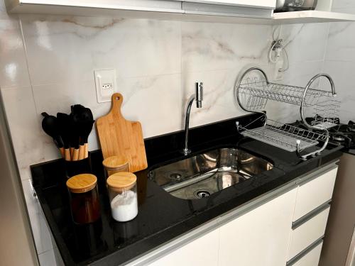 a kitchen with a sink and a counter top at Flat Sand Beach-IntermaresPB in Cabedelo