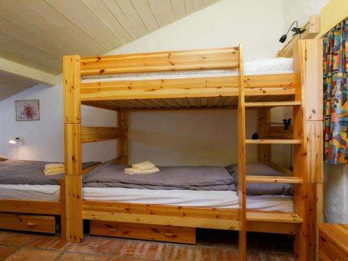 a bunk bed room with two bunk beds at Apartment Villaggio Sureggio A7 mit TicinoTicket by Interhome in Lugaggia
