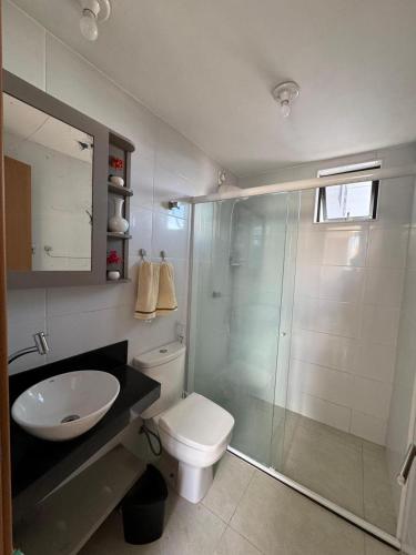 a bathroom with a shower and a toilet and a sink at Flat na melhor localização in Campina Grande