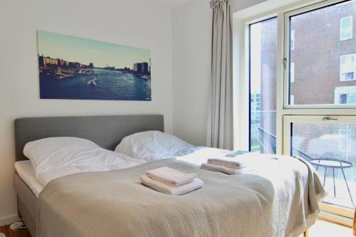 Ένα ή περισσότερα κρεβάτια σε δωμάτιο στο 2-BR apartment with a balcony in Ørestaden - 167
