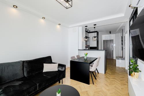 TV a/nebo společenská místnost v ubytování Balticus Apartamenty Promenada Gwiazd 14