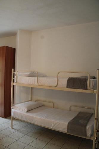Ένα ή περισσότερα κρεβάτια σε δωμάτιο στο Casa Golloi