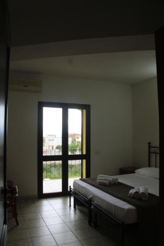 Ένα ή περισσότερα κρεβάτια σε δωμάτιο στο Casa Golloi