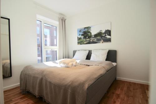Ένα ή περισσότερα κρεβάτια σε δωμάτιο στο 2-BR apartment with a balcony in Ørestaden - 166