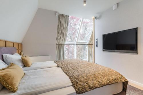 Ένα ή περισσότερα κρεβάτια σε δωμάτιο στο Imperial Apartments - Sopocka Perła