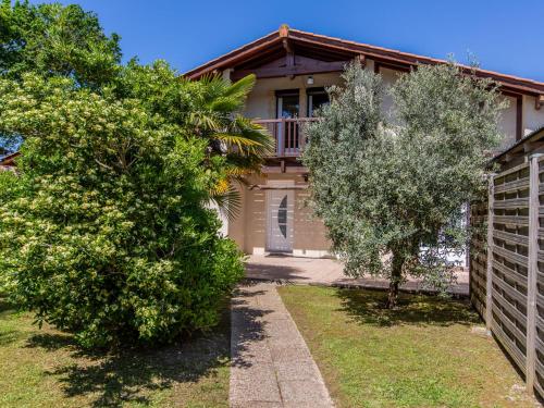 a house with trees in front of it at Holiday Home Labenne Océan - LBE115 by Interhome in Labenne