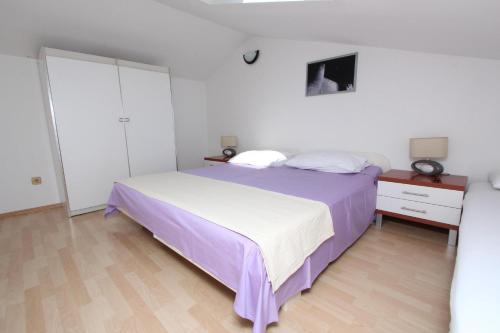 Postel nebo postele na pokoji v ubytování Rooms and Apartment Luana