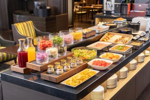 a buffet line with many different types of food at ANA Crowne Plaza Fukuoka by IHG in Fukuoka