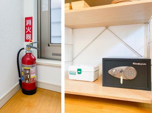 a fire extinguisher and a picture of a fire extinguisherventory at Ikebukuro area, three layer house, double subway,5 min walk to stn, 双地铁车站步行5分 直达新宿 涩谷 银座 池袋 皇居 可免费停车 最大10人 in Tokyo