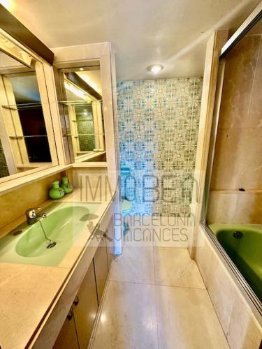 a bathroom with a green sink and a shower at BV-SV-002-Mediterrani in Sant Andreu de Llavaneres