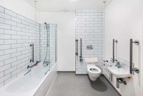 a bathroom with a toilet and a sink at Chapter Highbury I in London in London