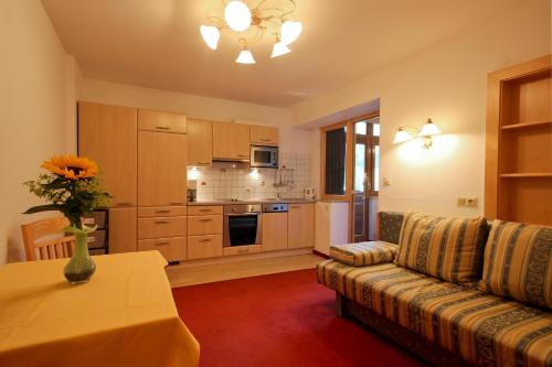 a living room with a couch and a table at Ladestatthof in Neustift im Stubaital