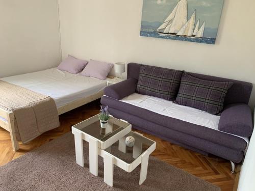 a living room with a couch and a sail boat at Apartment 877-1 in Bibinje
