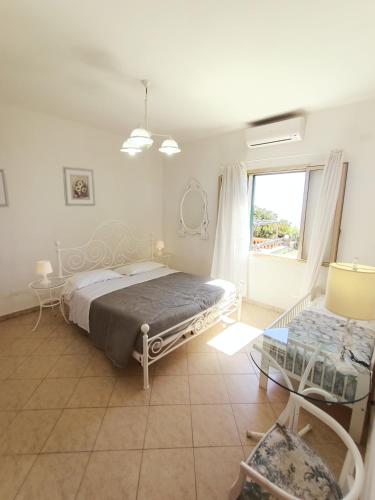 Ein Bett oder Betten in einem Zimmer der Unterkunft Le Dimore di Chiara