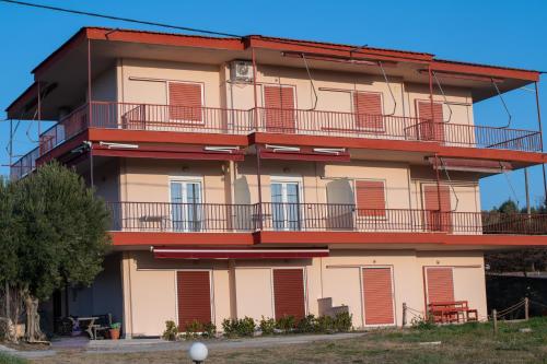 an apartment building with balconies on the side of it at Olea Apartments Palioura Epanomi in Epanomi