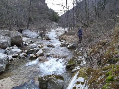 a person walking across a stream of water at Camin'hôtes Gîte Spa Drôme Lavande in Béconne