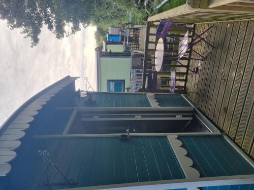 a row of roofs on top of a building at Glamping Hut - Riverview 3 in Welshpool
