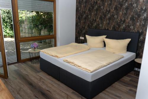 a bedroom with a bed in a room at Hotel Restaurant Moselblick in Wintrich