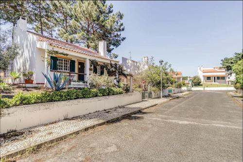 an empty street in front of a house at Casa da Falésia in Melides