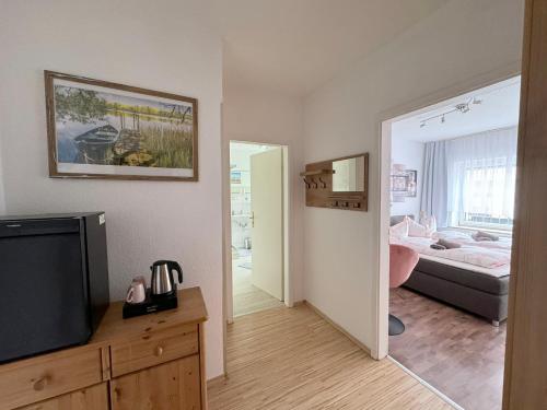 Ένα ή περισσότερα κρεβάτια σε δωμάτιο στο Hotel Nordlicht