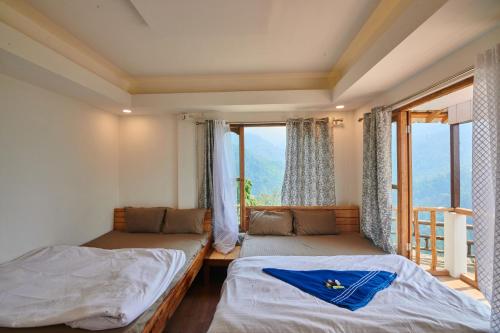 Postel nebo postele na pokoji v ubytování Skyline Retreat Lungchu
