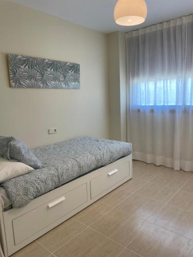 Un ou plusieurs lits dans un hébergement de l'établissement Apartamento Mirador Costa Golf