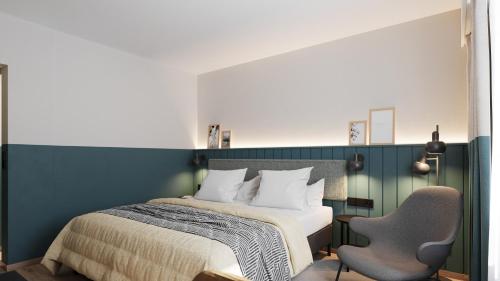 a bedroom with a bed and two chairs at City Hotel Biel Bienne Free Parking in Biel