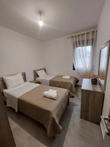 Ένα ή περισσότερα κρεβάτια σε δωμάτιο στο Irina's Apartment