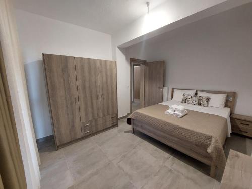 Ένα ή περισσότερα κρεβάτια σε δωμάτιο στο Irina's Apartment