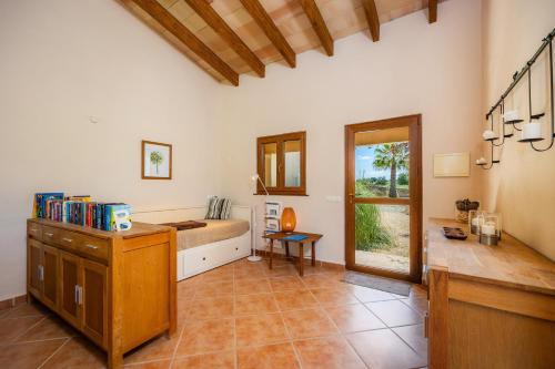a large room with a bed and a table in it at Buena Vista in Montuiri
