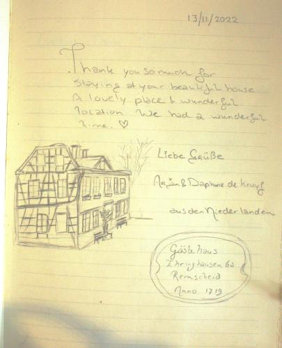 a drawing of a house on a piece of paper at Gästehaus Ehringhausen 63 (Anno 1719) in Remscheid