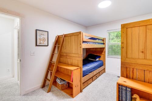 a bedroom with bunk beds and a ladder at Beaver Lake Getaway with 2 Decks, Grill, and Views! in Garfield
