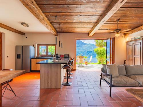 an open kitchen and living room with a couch at Holiday Home Cape Cod by Interhome in Vercana
