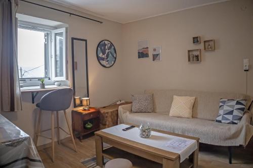 a living room with a couch and a table at Auntie Katie's house in Giannádes