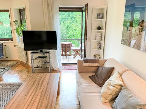 a living room with a couch and a flat screen tv at Apartment Kersten by Interhome in Essen