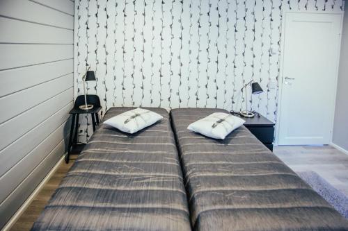 Кровать или кровати в номере SleepWell Villa Hartola