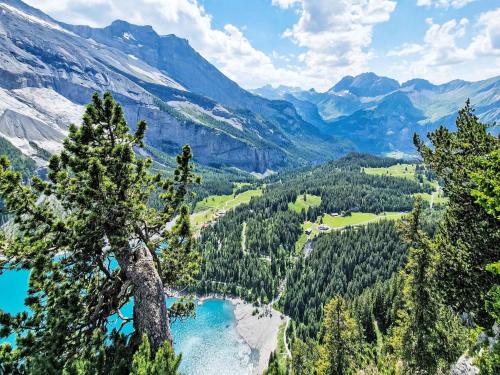a view of a mountain valley with a blue lake at Apartment Bergluft by Interhome in Kandersteg