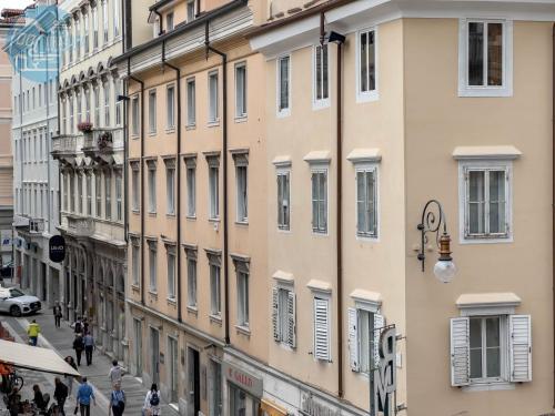 a group of buildings on a city street at San Nicolò 14 Tirabora Short Rent in Trieste