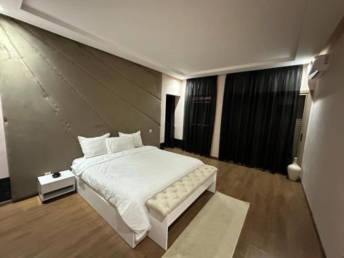 a bedroom with a large white bed in a room at Marrakech villa in Marrakech