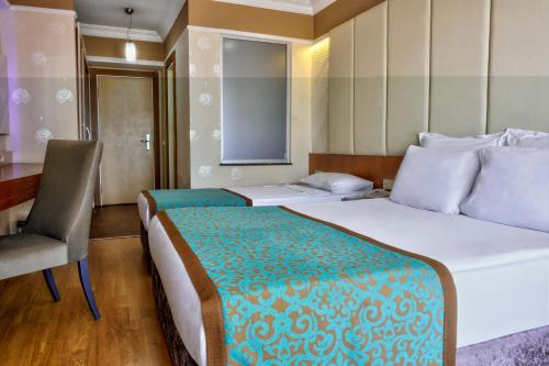 Ένα ή περισσότερα κρεβάτια σε δωμάτιο στο Tac Premier Hotel & Spa