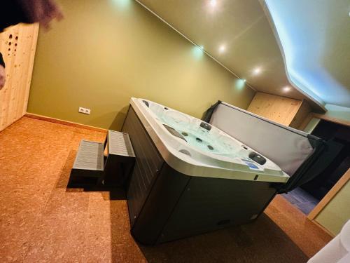 a bathroom with a sink in a room at LE Relais des Anges in Rupt-sur-Moselle