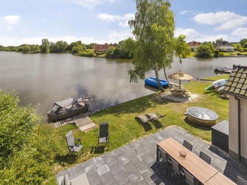 an aerial view of a river with a boat in the water at Holiday Home Lethehuis by Interhome in Vlagtwedde