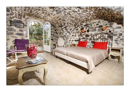 En eller flere senge i et værelse på Ferme du Pic d'Allier