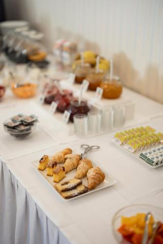 a table with several plates of food on it at Weingarten Terlan - Rooms & Breakfast in Terlano