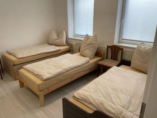 Ένα ή περισσότερα κρεβάτια σε δωμάτιο στο Zimmer in Rom