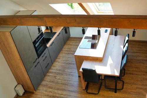 an overhead view of a kitchen with a table and chairs at Old Mill House in Bohinj